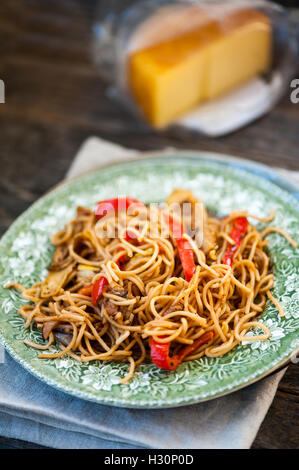 Noodles with eggplant, zucchini and red pepper Stock Photo