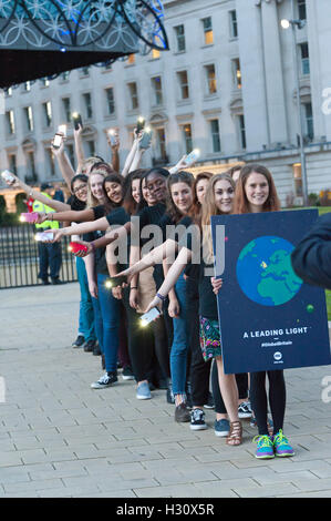 Birmingham, West Midlands, UK. 2nd October 2016. 'One' an advocacy group which campaigns for world governments to fight corruption and extreme poverty get together for a photo call outside the venue of the annual Conservative Party Conference which is being held in Birmingham, West Midlands, UK. between 2nd – 5th October 2016. Credit:  Graham M. Lawrence/Alamy Live News.