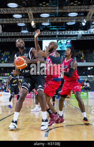 Stratford, London, UK. 02nd Oct, 2016. Copper Box Arena, London, 2nd October 2016. Lions' Hassan Rashad (22) tries to push through with Bristol's Brandon Boggs (24) and Lovell Cook (6) trying to block him. London Lions beat Bristol Flyers 86-66 in the British Basketball League Championship game at the Copper Box Arena in the Olympic Park, Stratford. Credit:  Imageplotter News and Sports/Alamy Live News