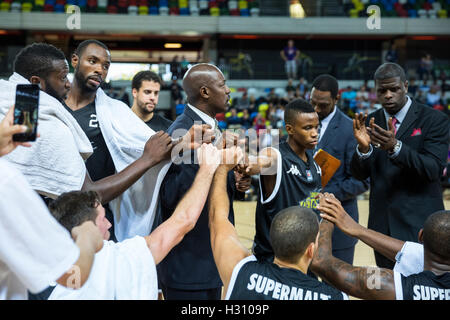 Stratford, London, UK. 02nd Oct, 2016. Copper Box Arena, London, 2nd October 2016. London Lions players high five after a good 3rd quarter. London Lions beat Bristol Flyers 86-66 in the British Basketball League Championship game at the Copper Box Arena in the Olympic Park, Stratford. Credit:  Imageplotter News and Sports/Alamy Live News Stock Photo