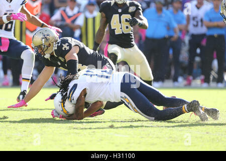 San Diego, CA, USA. 2nd Oct, 2016. October 2, 2016: San Diego Chargers wide receiver Travis Benjamin (12) gives up a critical fumble late int he fourth quarter after a hit by New Orleans Saints defensive back Sterling Moore (24) in the game between the New Orleans Saints and San Diego Chargers, Qualcomm Stadium, San Diego, CA. Peter Joneleit/ ZUMA Wire Service Credit:  Peter Joneleit/ZUMA Wire/Alamy Live News Stock Photo