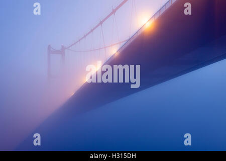 Barton-upon-Humber, North Lincolnshire, UK. 3rd October 2016. The Humber Bridge shrouded in early morning mist as temperatures dip towards freezing. Credit:  LEE BEEL/Alamy Live News Stock Photo