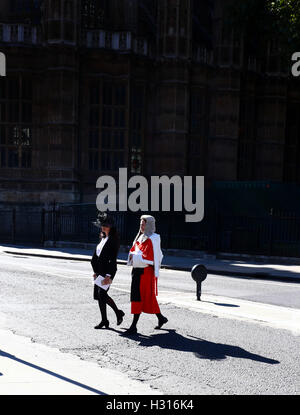 London, UK. 03rd Oct, 2016. Start of the Legal Year . Westminster, London . 03.10.2016 A judge looking resplendent in her robes and wig as they process from Westminster Abbey to the Houses of Parliament. A service in Westminster Abbey is conducted by the Dean of Westminster to mark the start of the legal year. Judges, law officers, Queen's Counsel (QC), government ministers and lawyers attend the service, with Judges and QC's wearing ceremonial dress. Credit:  Paul Marriott Photography/ Alamy Live News Stock Photo