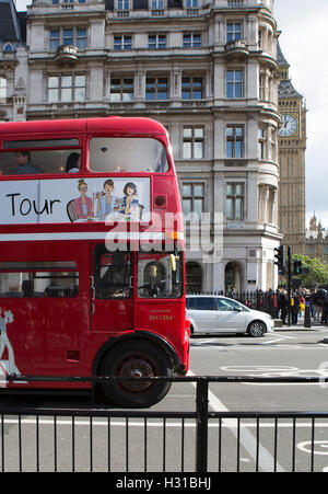 Old Red Routemaster London Bus tour near Big Ben Stock Photo