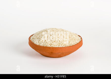 Basmati Rice (uncooked) in a clay bowl Stock Photo
