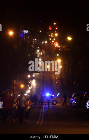 Crowd gathered at city event at night Stock Photo