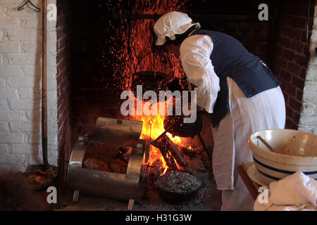 Demonstration of old style cooking in fireplace Stock Photo