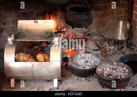 Old style cooking in fireplace Stock Photo