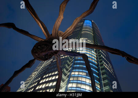 Maman giant spider sculpture ( 2003) by Louise Bourgeois in front of Mori tower  in Roppongi Hills located in the Roppongi district of Minato, Tokyo Stock Photo
