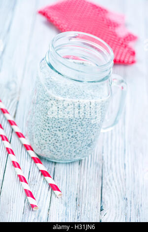 milk with chia in the glass and on a table Stock Photo