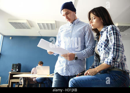 Happy web designers brainstorming about new sartup Stock Photo