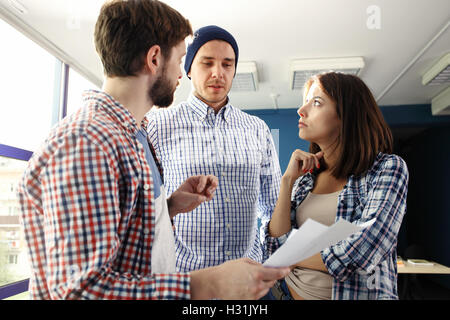 Happy web designers brainstorming about new sartup Stock Photo
