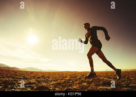 Sportsman running on the sky nature concept Stock Photo