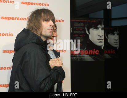 Liam Gallagher (left) and director Mat Whitecross arriving for a special screening of Supersonic, at Vue Cinema, Leicester Square, London. Stock Photo