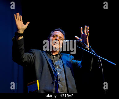 Comedian Mark Thomas performing at the Rich Mix in London to commemorate the 80th anniversary of the Battle of Cable St. mural in east London, UK, Stock Photo