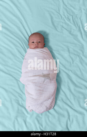 View of a newborn baby on smooth bed Stock Photo - Alamy