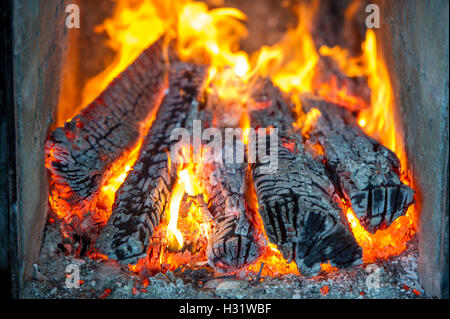 Logs burning in a fireplace in Gorham, Maine Stock Photo