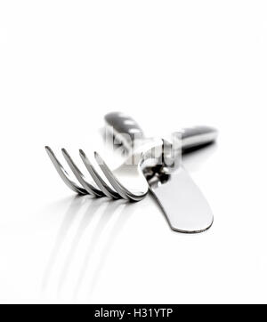 Cutlery, fork with knife isolated on white, close up Stock Photo