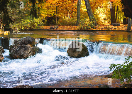 Waterfall in autumn in Munich city as background Stock Photo