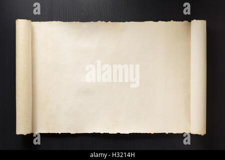parchment scroll on wooden background Stock Photo