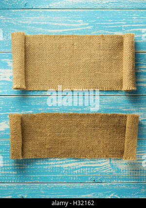 burlap hessian sacking on wooden background Stock Photo