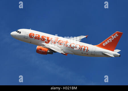 EasyJet Switzerland Airbus A319-100 banking left after taking off from El Prat Airport in Barcelona, Spain. Stock Photo