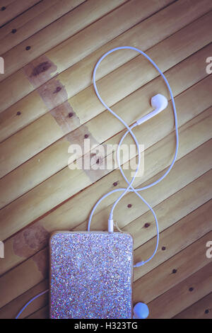 Headphones on a wooden table Stock Photo