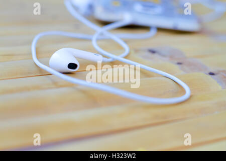 Headphones on a wooden table Stock Photo
