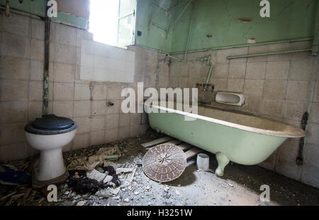 Interior of a dirty  empty demolished abandoned bathroom. Stock Photo