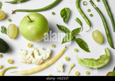 Green vegetables and fruits isolated on white. Ingredients for diet Stock Photo