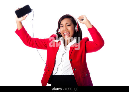 Beautiful happy business woman jamming singing listening to music on wireless mobile phone, on white. Stock Photo