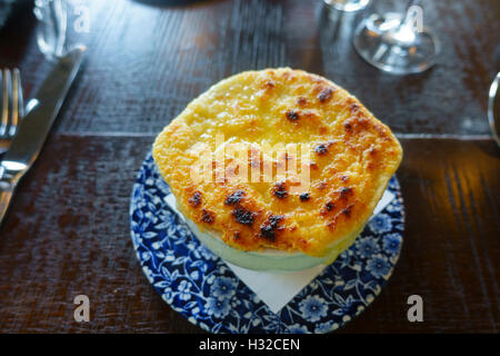 French Onion Soup on a blue plate Stock Photo