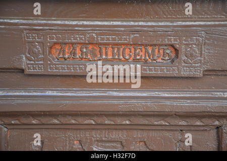 Mail slot in old wooden door Stock Photo