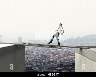 business man walk on danger improvised bridge Stock Photo