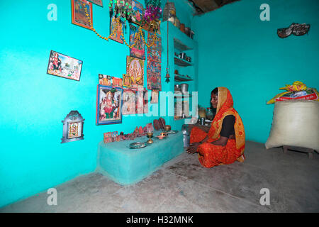 Woman performing ritual puja ceremony. Shivala Ghat. Ganges river Stock