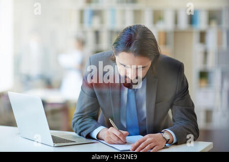 Businessman busy at work Stock Photo