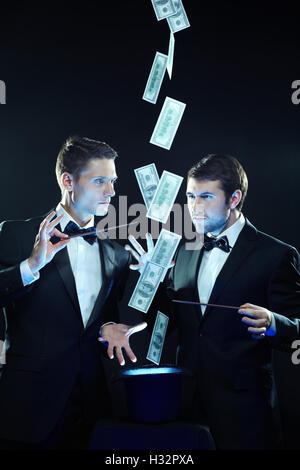 Conjuring over money Stock Photo