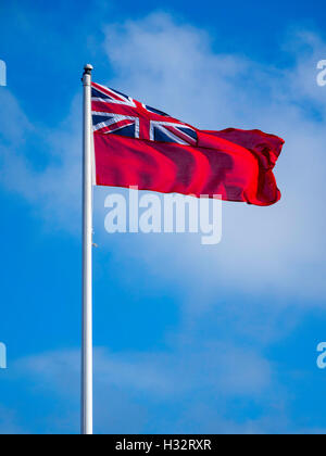 British Merchant Navy flag the Red Ensign against blue sky Stock Photo