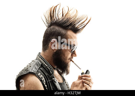 Punker lighting up a cigarette isolated on white background Stock Photo