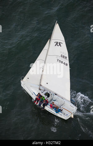 Looking down onto a sail boat from the Forth Road Bridge, Scotland Stock Photo