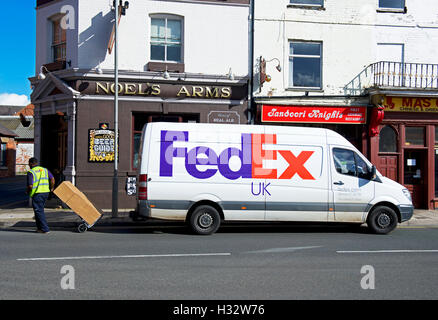 FedEx employee delivering a packet, England UK Stock Photo