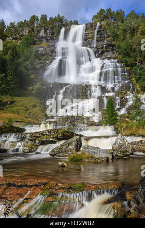 Tvindefossen (also written Tvinnefossen; also called Trollafossen) is a waterfall near Voss, Norway. Stock Photo