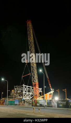 Steelwork arch installation,a significant engineering operation,Dundee,UK. One half of arch is lifted. Stock Photo