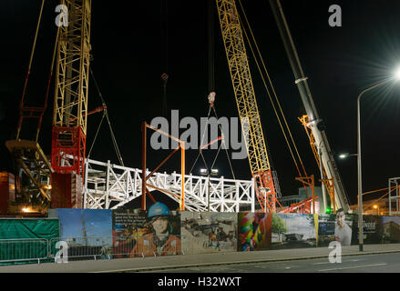 Steelwork arch installation,a significant engineering operation,Dundee,UK.Arch sections brought into alignment by cranes. Stock Photo