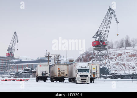 Turku, Finland - January 17, 2016: Cranes and trucks in Port of Turku, Finland in winter season Stock Photo