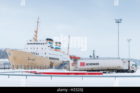 Turku, Finland - January 17, 2016: Loading of cargo ship. Port of Turku, Finland in winter season Stock Photo