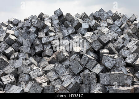 Mountain of scrap metal, pressed into cubes, metal waste from industrial production, Port of Duisburg, Duisport, Ruhr district Stock Photo