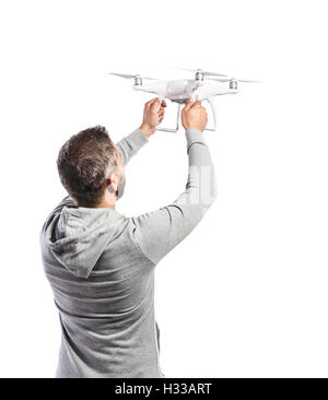 Man holding drone. Studio shot on white background, isolated Stock Photo