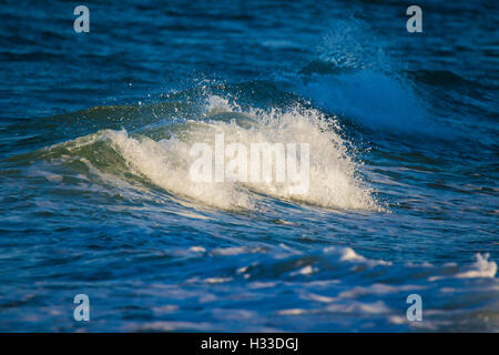 A powerful wave breaking near the shore in Cape-Code. Stock Photo