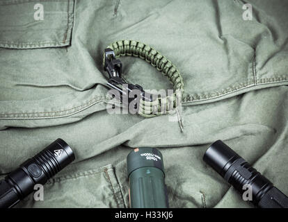 Military paracord bracelet, tactical torch and spy-glass Stock Photo